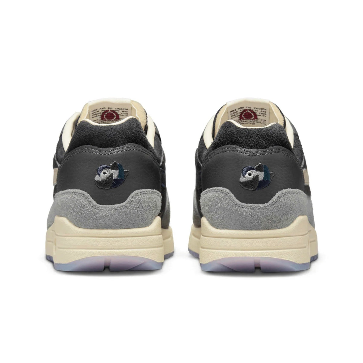 A rear view of the Kasina x Nike Air Max 1 Wong-Ang Grey trainers, showing the embroidered Wong-Ang duck detail and premium grey and teal materials.