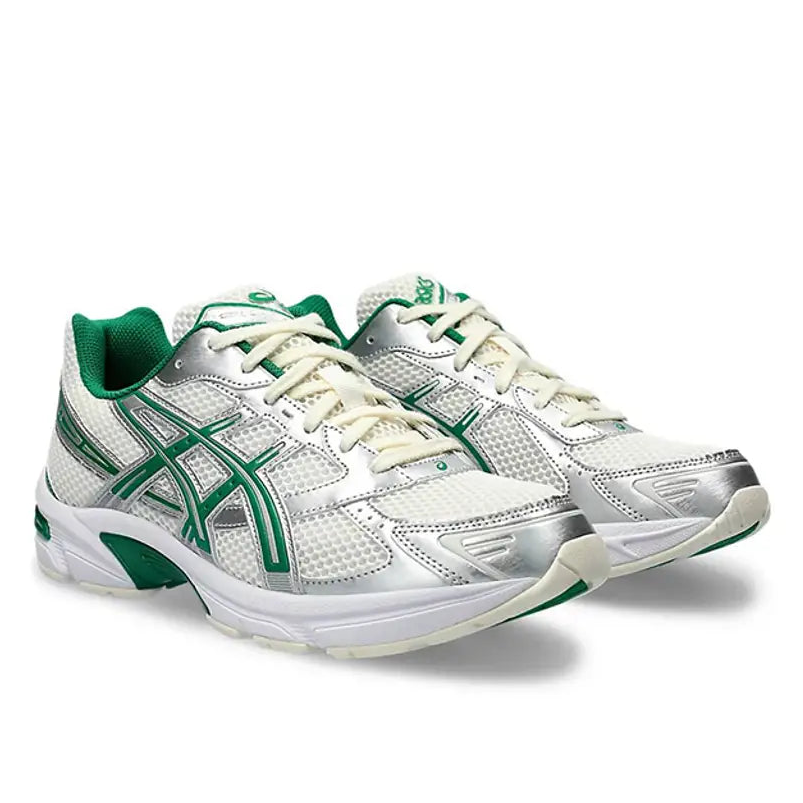 A pair of ASICS GEL-1130 Cream Kale trainers featuring cream mesh, muted green accents, layered synthetic overlays, signature ASICS stripes and a cushioned GEL sole on a clean white background.