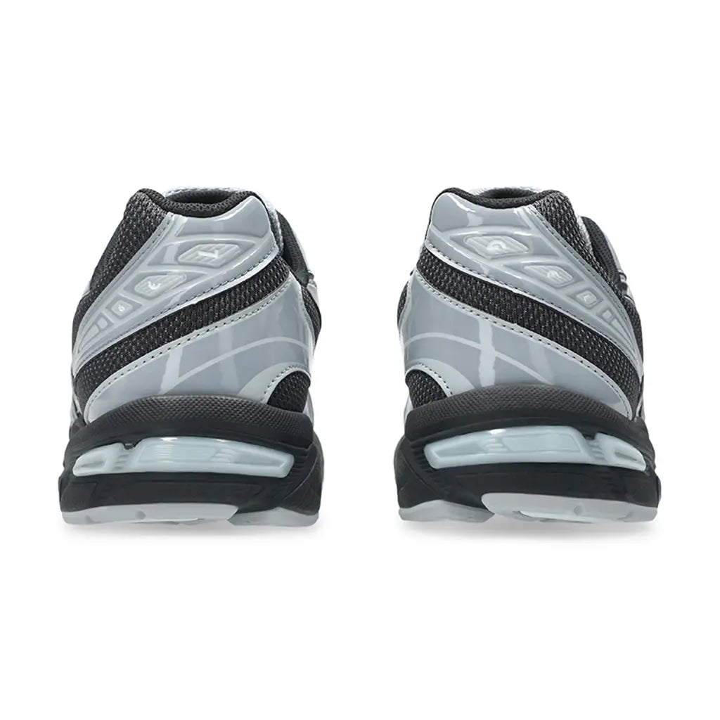 A rear view of the ASICS GEL-1130 Graphite Grey Gravel trainers, showing the structured dark grey heel, glossy detailing and GEL cushioned midsole on a clean white background.