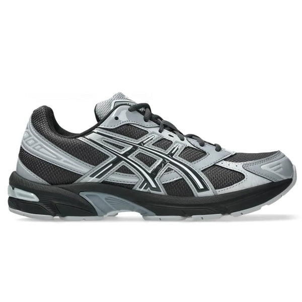 A side view of the ASICS GEL-1130 Graphite Grey Gravel trainer, showing the dark grey mesh upper, glossy Gravel overlays, tonal ASICS stripes and sculpted cushioned midsole.