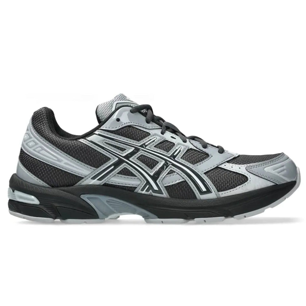 A side view of the ASICS GEL-1130 Graphite Grey Gravel trainer, showing the dark grey mesh upper, glossy Gravel overlays, tonal ASICS stripes and sculpted cushioned midsole.