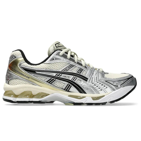 A side view of the ASICS GEL-KAYANO 14 Birch Silver trainer, showing the Birch mesh upper, metallic silver overlays, contrasting black ASICS stripes and technical GEL midsole.