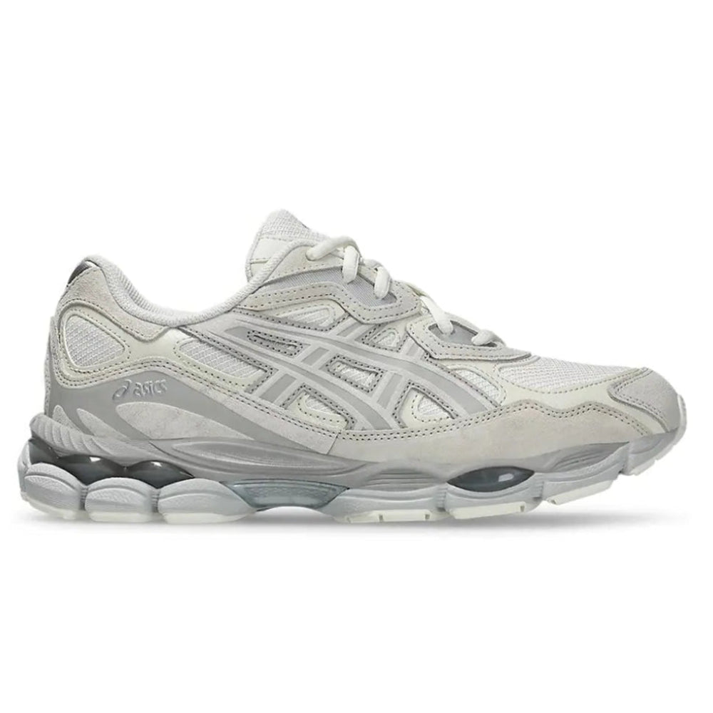 A side view of the ASICS GEL-NYC Cream Grey trainer, showing the cream mesh upper, grey ASICS stripe detailing, layered suede and synthetic overlays and sculpted sole.