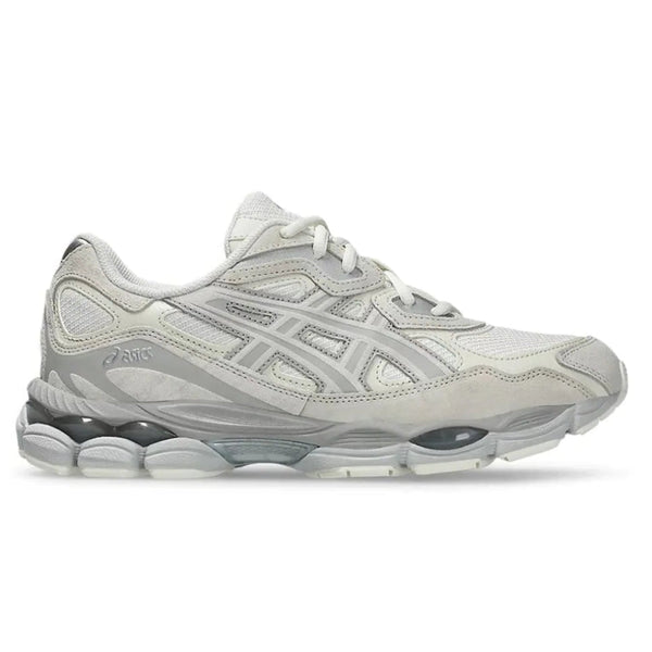 A side view of the ASICS GEL-NYC Cream Grey trainer, showing the cream mesh upper, grey ASICS stripe detailing, layered suede and synthetic overlays and sculpted sole.
