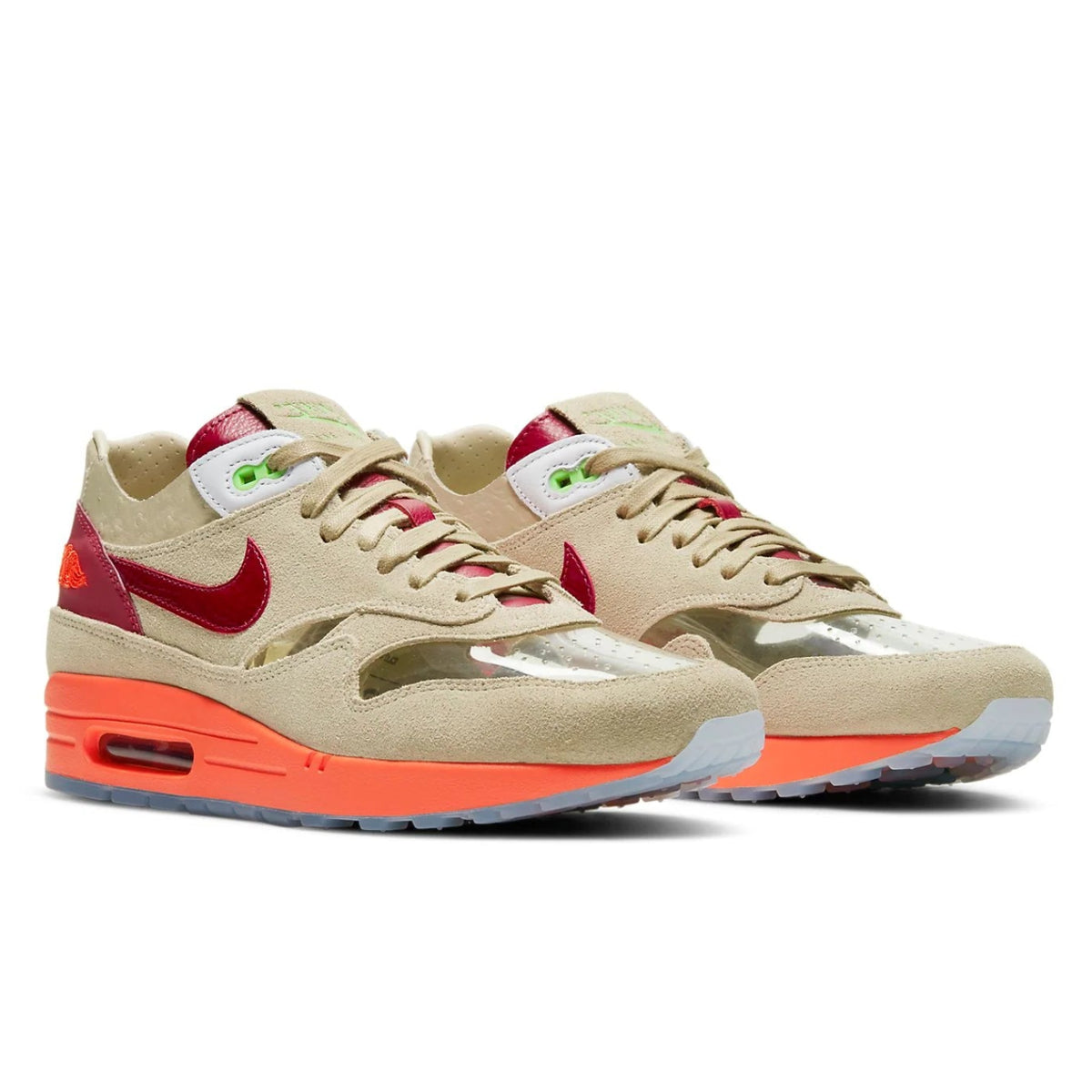 A pair of CLOT x Nike Air Max 1 Kiss of Death 2021 trainers featuring translucent uppers, red Swooshes and icy blue outsoles on a clean white background.