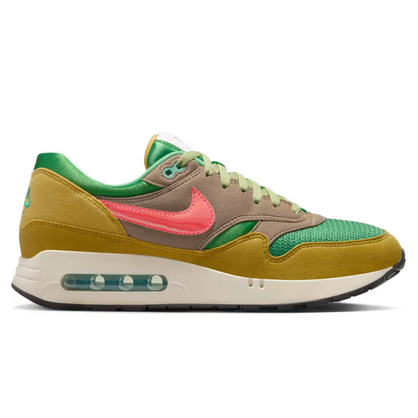 A side view of the Nike Air Max 1 ’86 PRM Powerwall BRS trainer, showing the green mesh upper, Pale Bronzine suede panels, orange Swoosh and visible Big Bubble Air unit.