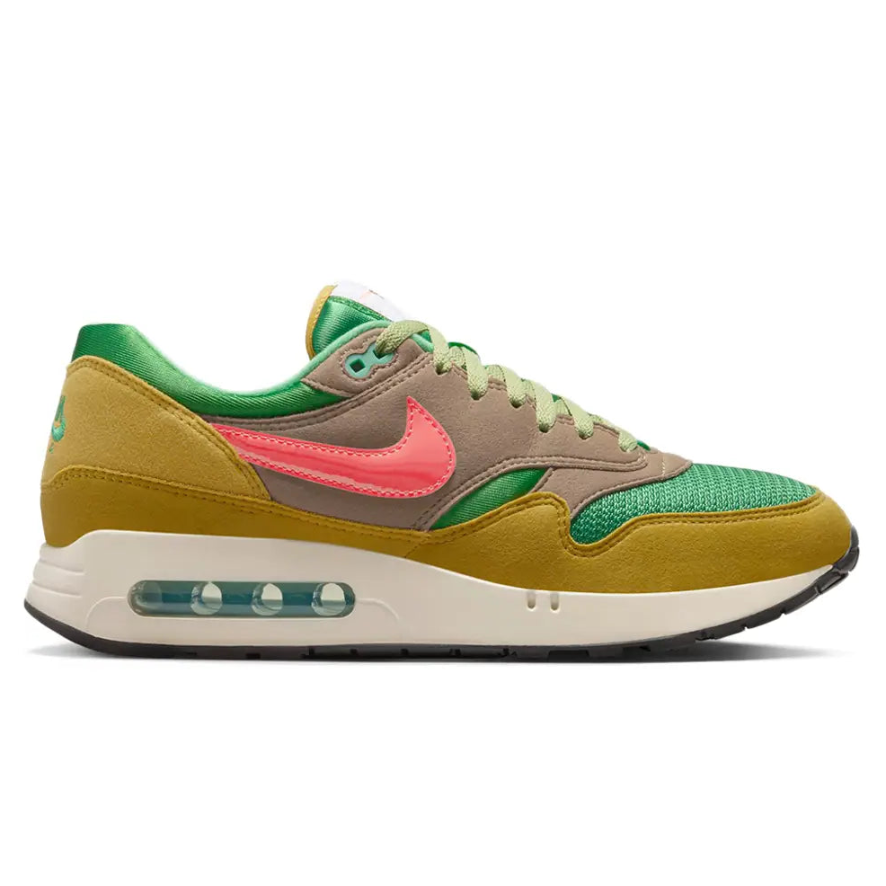 A side view of the Nike Air Max 1 ’86 PRM Powerwall BRS trainer, showing the green mesh upper, Pale Bronzine suede panels, orange Swoosh and visible Big Bubble Air unit.
