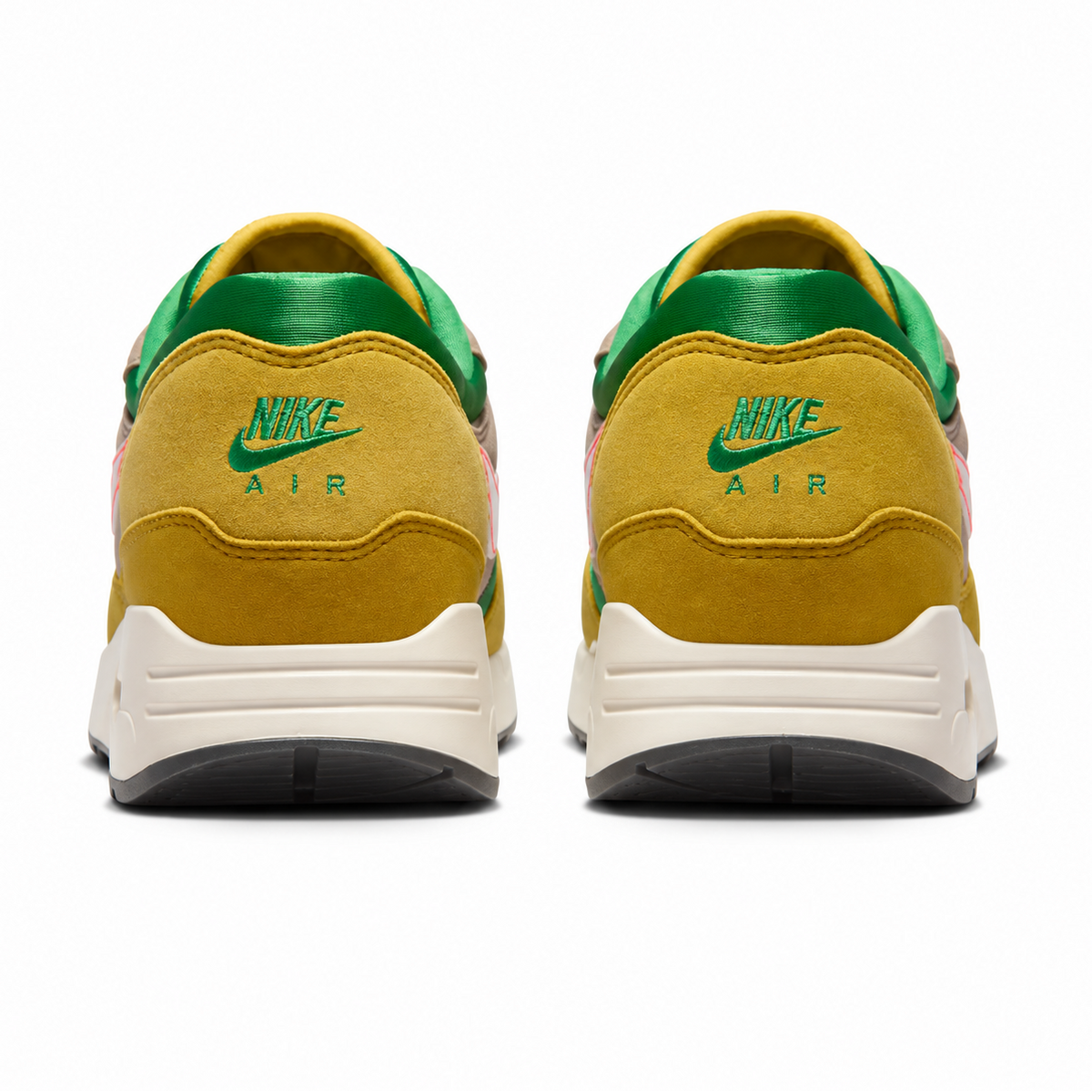 A rear view of the Nike Air Max 1 ’86 PRM Powerwall BRS trainers, showing the suede heel, traditional Nike Air branding and earthy green, brown and orange colour palette.