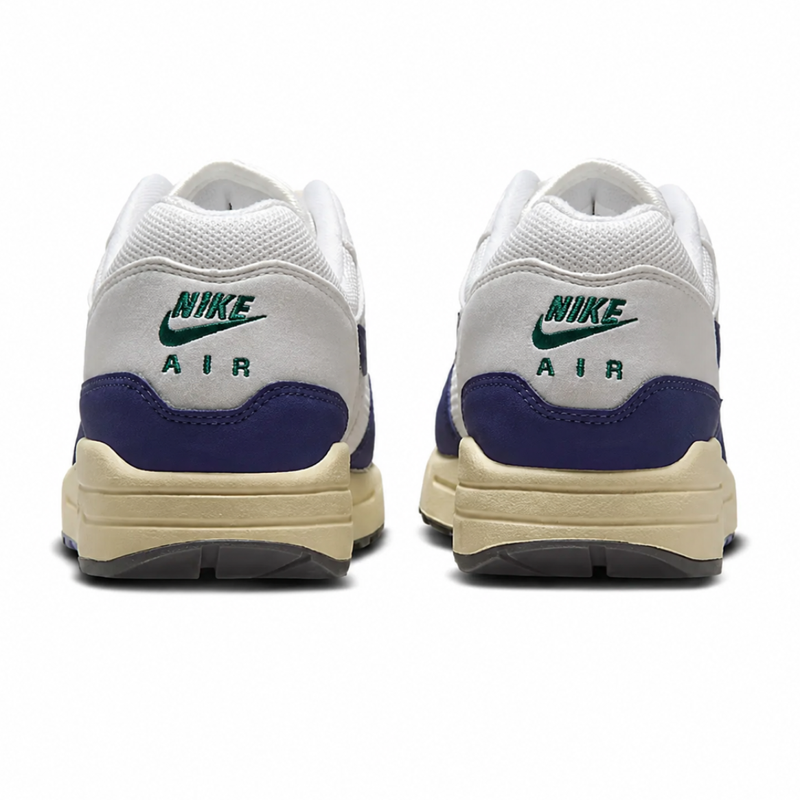 A pair of Nike Air sneakers shown from the back, featuring a white mesh upper, a navy blue heel tab, a green Nike logo, and a beige midsole.