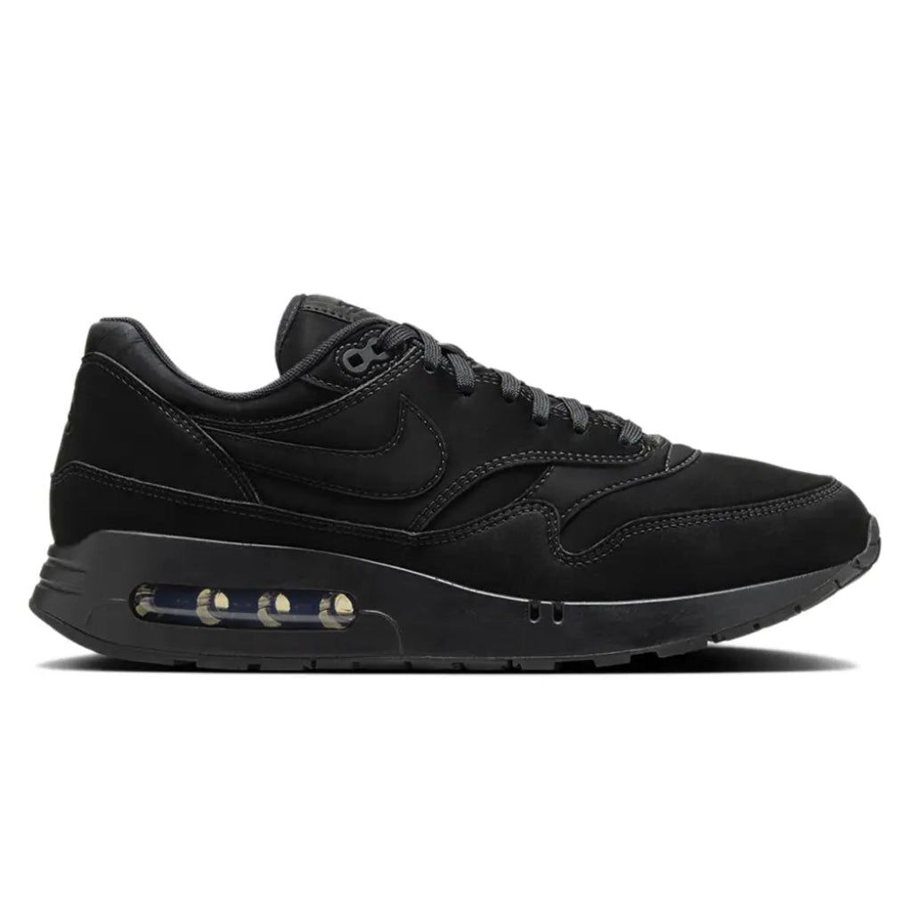A side view of the Nike Air Max 1 Golf Black Cat showing the black layered upper, tonal Nike Swoosh and visible Air cushioning.