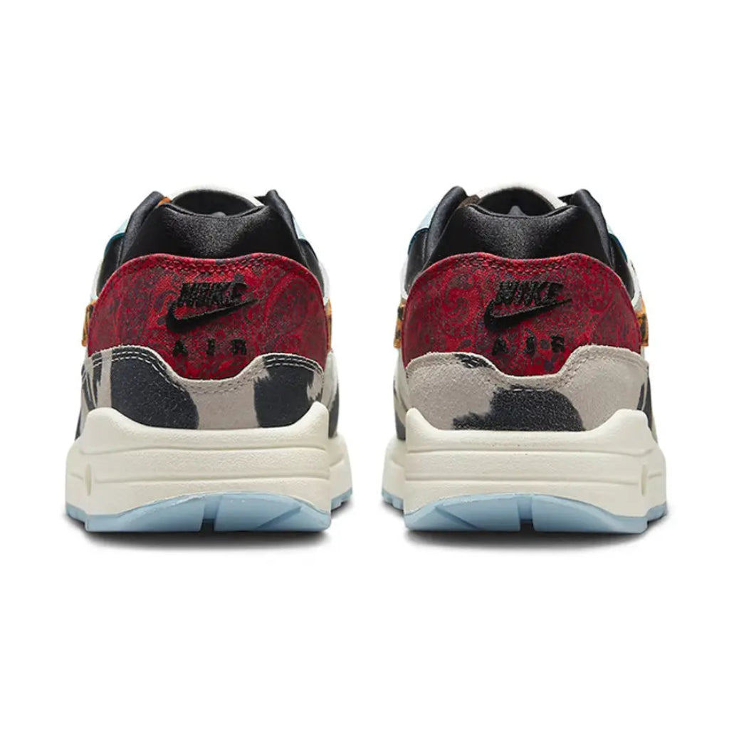 A rear view of the Nike Air Max 1 Wild Animal showing the red paisley heel panel, premium lining and mixed-texture construction.