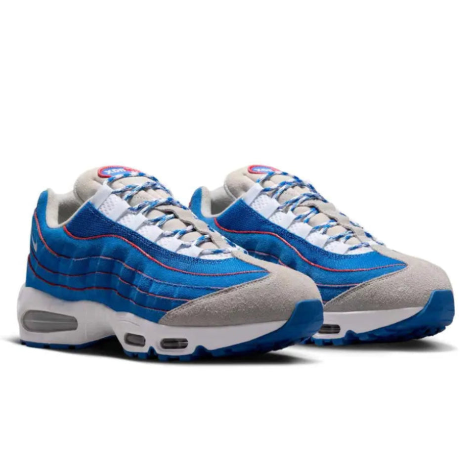 A pair of Nike Air Max 95 Lawson Blue Sapphire trainers featuring white mesh, layered blue side panels, textured suede overlays and visible Air cushioning on a clean white background.