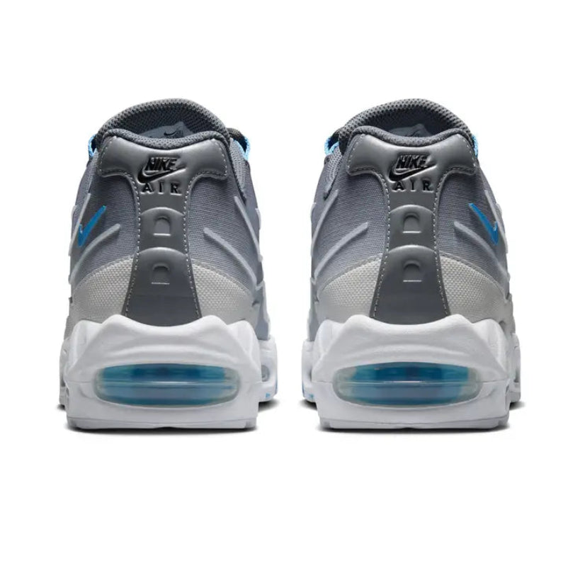 A rear view of the Nike Air Max 95 Smoke Grey trainers, showing the structured heel, layered grey and white detailing, blue accents and visible Air cushioning.