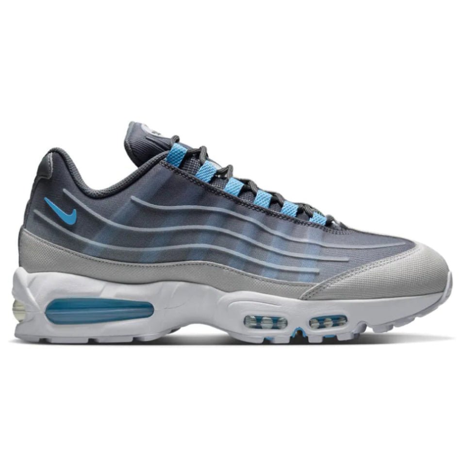 A side view of the Nike Air Max 95 Smoke Grey trainer, showing the signature wavy grey panels, white detailing, Football Blue accents and visible Air cushioning.