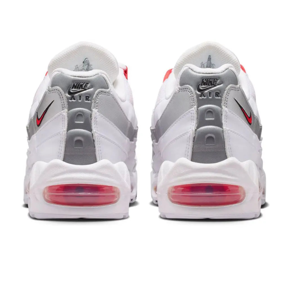 Nike Air Max 95 England heel view showing white upper, metallic silver spine detail, red accents and durable rubber outsole