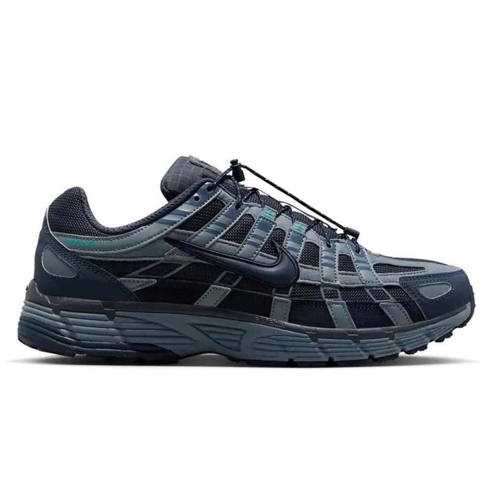 A side view of the Nike P-6000 Winterised Thunder Eclipse trainer, showing the layered Thunder Blue upper, Blue Graphite detailing, Clear Jade accents and sculpted foam midsole.