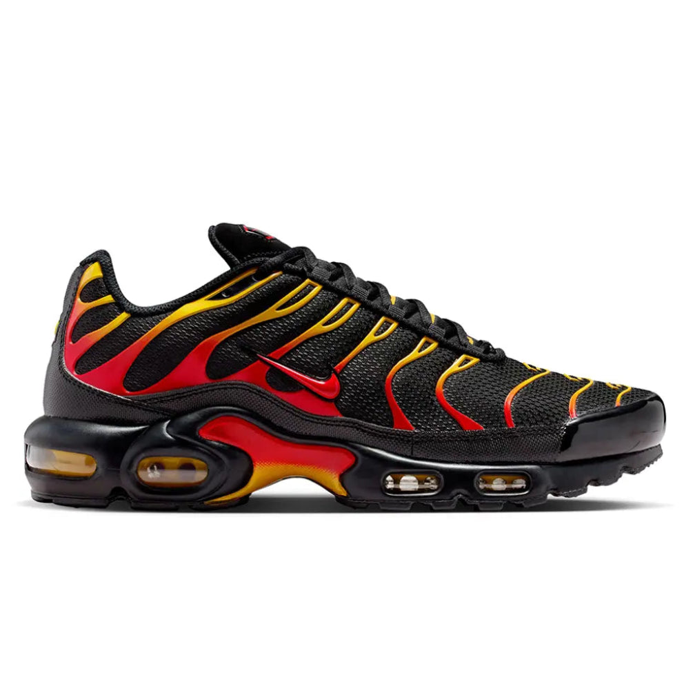 A side view of the Nike Air Max Plus TN Black University Gold University Red trainer, showing the black upper, fiery red and gold TPU cage, Nike Swoosh and sculpted Tuned Air sole.