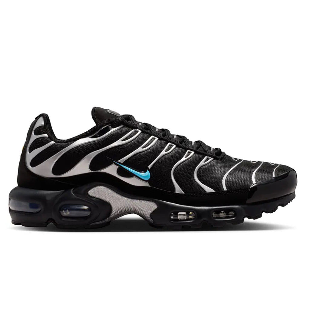 A side view of the Nike Air Max Plus VII Scorpion Black trainer, showing the sleek black upper, sculpted overlays and visible Air cushioned sole.