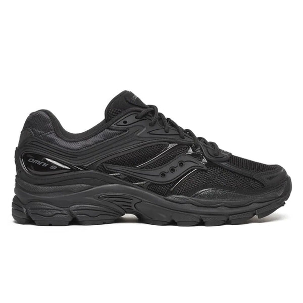 A side view of the Saucony ProGrid Omni 9 Armour Black trainer, showing the monochromatic black upper, signature Saucony wave logo, intricate layered construction and sculpted ProGrid sole.