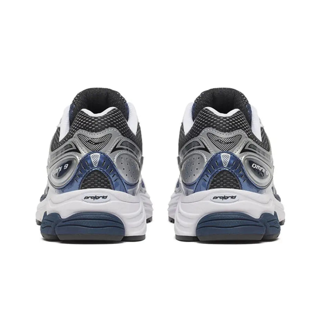 Back heel view of the Saucony ProGrid Omni 9 Deep Navy running shoe, displaying the supportive heel structure, rich navy tones, and durable rubber outsole.